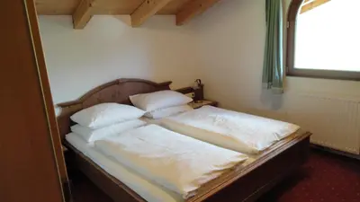 Ein Bett oder Betten in einem Zimmer der Unterkunft Ferienwohnungen Birnbacher