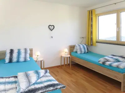 Ein Bett oder Betten in einem Zimmer der Unterkunft Apartment Zillertalblick by Interhome