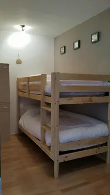 Ein Bett oder Betten in einem Zimmer der Unterkunft Villa Zeppelin - App Bergkristall