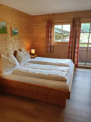 Ein Bett oder Betten in einem Zimmer der Unterkunft Ferienwohnungen Schneiderhäusl