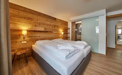 Ein Bett oder Betten in einem Zimmer der Unterkunft Glemm Lodge Apartments - JOKER CARD im Sommer inklusive