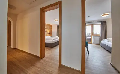 Ein Bett oder Betten in einem Zimmer der Unterkunft Glemm Lodge Apartments - JOKER CARD im Sommer inklusive