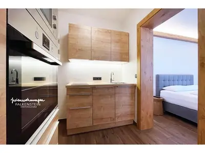 Ein Bett oder Betten in einem Zimmer der Unterkunft Ferienwohnungen Falkenstein Hinterglemm