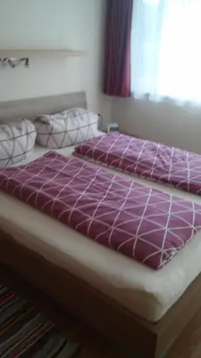 Ein Bett oder Betten in einem Zimmer der Unterkunft Ferienwohnung Kogler