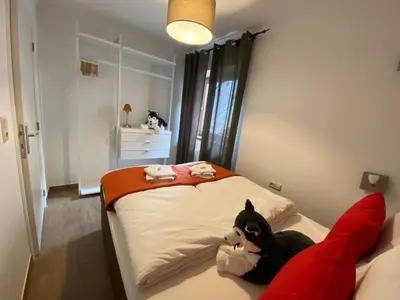 Ein Bett oder Betten in einem Zimmer der Unterkunft Residence Cocoon