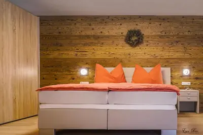 Ein Bett oder Betten in einem Zimmer der Unterkunft Jochberg Hoamatl