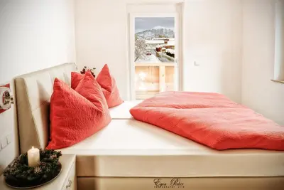 Ein Bett oder Betten in einem Zimmer der Unterkunft Jochberg Hoamatl