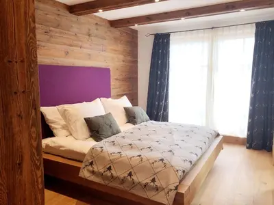 Ein Bett oder Betten in einem Zimmer der Unterkunft The LODGE, Saalbach