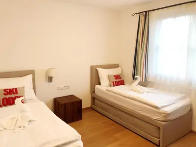 Ein Bett oder Betten in einem Zimmer der Unterkunft The LODGE, Saalbach