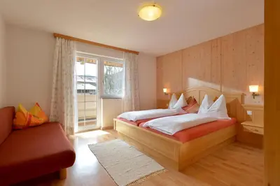 Ein Bett oder Betten in einem Zimmer der Unterkunft Appartements Alpenblick Söll