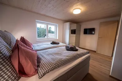 Ein Bett oder Betten in einem Zimmer der Unterkunft Mayerl's Kaiserappartement