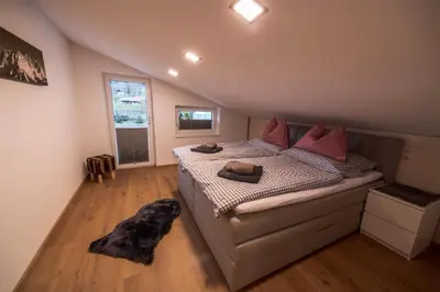 Ein Bett oder Betten in einem Zimmer der Unterkunft Mayerl's Kaiserappartement