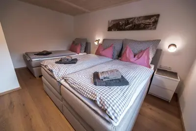 Ein Bett oder Betten in einem Zimmer der Unterkunft Mayerl's Kaiserappartement