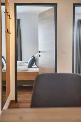 Ein Bett oder Betten in einem Zimmer der Unterkunft Wiesl Lodge Saalbach