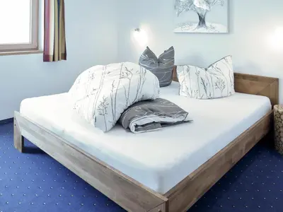 Ein Bett oder Betten in einem Zimmer der Unterkunft Apartment Luxner-5 by Interhome
