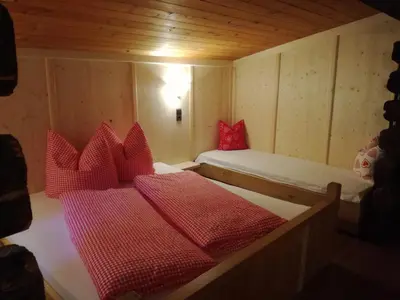 Ein Bett oder Betten in einem Zimmer der Unterkunft Tanterhütte by Tanterhof