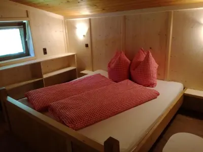 Ein Bett oder Betten in einem Zimmer der Unterkunft Tanterhütte by Tanterhof