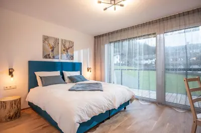 Ein Bett oder Betten in einem Zimmer der Unterkunft Kaiser Appartement Brixen im Thale