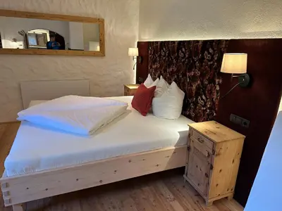 Ein Bett oder Betten in einem Zimmer der Unterkunft Ferienchalet Katharina