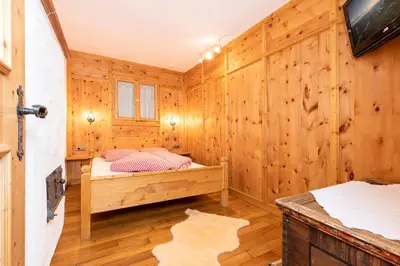 Ein Bett oder Betten in einem Zimmer der Unterkunft Ferienchalet Katharina