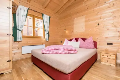 Ein Bett oder Betten in einem Zimmer der Unterkunft Alpen-Chalets Achensee