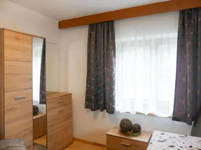 Ein Bett oder Betten in einem Zimmer der Unterkunft Apartment Viktoria by Interhome
