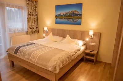 Ein Bett oder Betten in einem Zimmer der Unterkunft Ferienwohnung Hinterkaiser