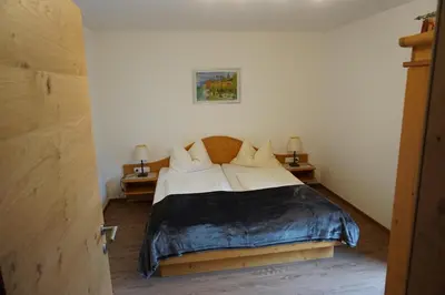 Ein Bett oder Betten in einem Zimmer der Unterkunft Appartementhaus Hüttenberger
