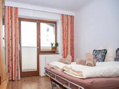 Ein Bett oder Betten in einem Zimmer der Unterkunft Farmhouse in Hollersbach near Ski Slopes