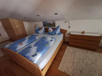 Ein Bett oder Betten in einem Zimmer der Unterkunft Lamplhof