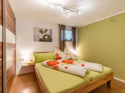 Ein Bett oder Betten in einem Zimmer der Unterkunft Ferienwohnung Petra