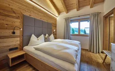 Ein Bett oder Betten in einem Zimmer der Unterkunft Chalet Dirndl und Buam
