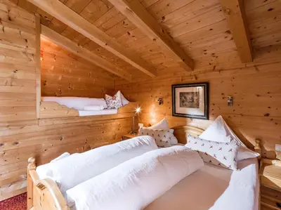 Ein Bett oder Betten in einem Zimmer der Unterkunft Chalets Berglehen