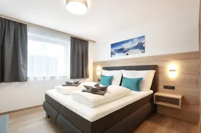 Ein Bett oder Betten in einem Zimmer der Unterkunft Apart Alina
