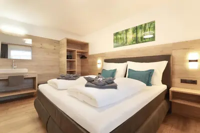 Ein Bett oder Betten in einem Zimmer der Unterkunft Apart Alina