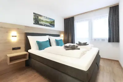 Ein Bett oder Betten in einem Zimmer der Unterkunft Apart Alina
