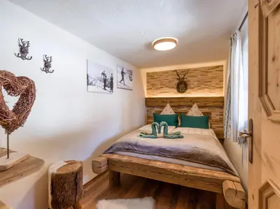 Ein Bett oder Betten in einem Zimmer der Unterkunft Chalet Hüttenzauber