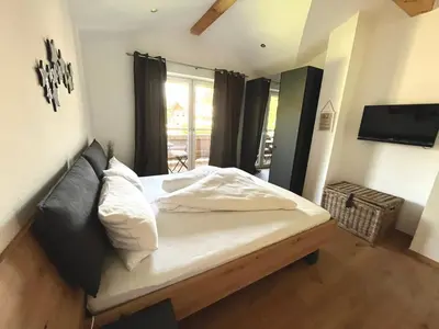 Ein Bett oder Betten in einem Zimmer der Unterkunft Penthouse Brixen