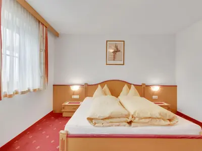 Ein Bett oder Betten in einem Zimmer der Unterkunft Apartment in Hainzenberg near Ski Lift