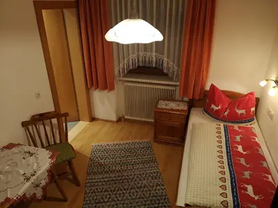 Ein Bett oder Betten in einem Zimmer der Unterkunft Gästehaus Luxner