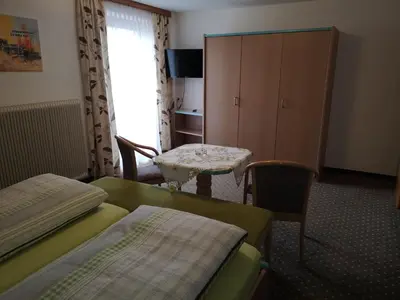 Ein Bett oder Betten in einem Zimmer der Unterkunft Gästehaus Luxner