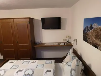 Ein Bett oder Betten in einem Zimmer der Unterkunft Gästehaus Luxner