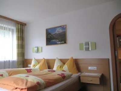Ein Bett oder Betten in einem Zimmer der Unterkunft Gästehaus Luxner