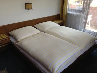 Ein Bett oder Betten in einem Zimmer der Unterkunft Haus Tenk