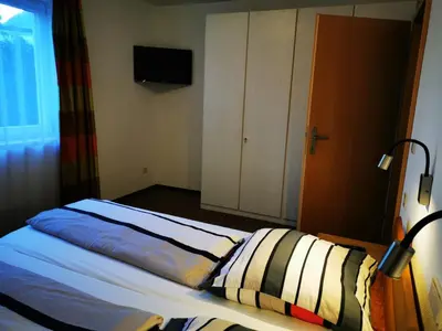 Ein Bett oder Betten in einem Zimmer der Unterkunft Ferienwohnung Obermoser