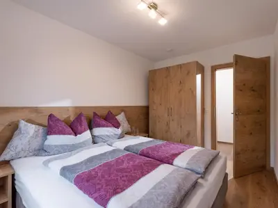 Ein Bett oder Betten in einem Zimmer der Unterkunft Bergappartements Reithammer - Ellmau