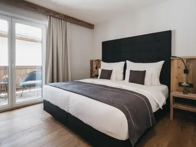 Ein Bett oder Betten in einem Zimmer der Unterkunft VAYA Gerlos