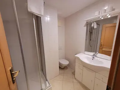 Ein Badezimmer in der Unterkunft Ferienhotel Alpenhof