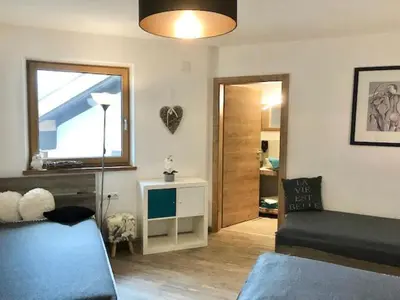 Ein Sitzbereich in der Unterkunft Restaurant Appartements Almdiele