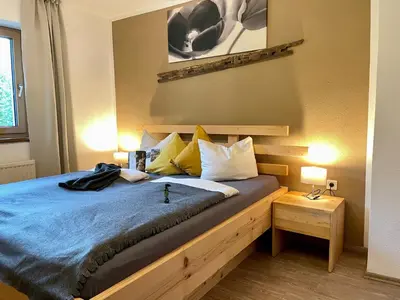 Ein Bett oder Betten in einem Zimmer der Unterkunft Restaurant Appartements Almdiele